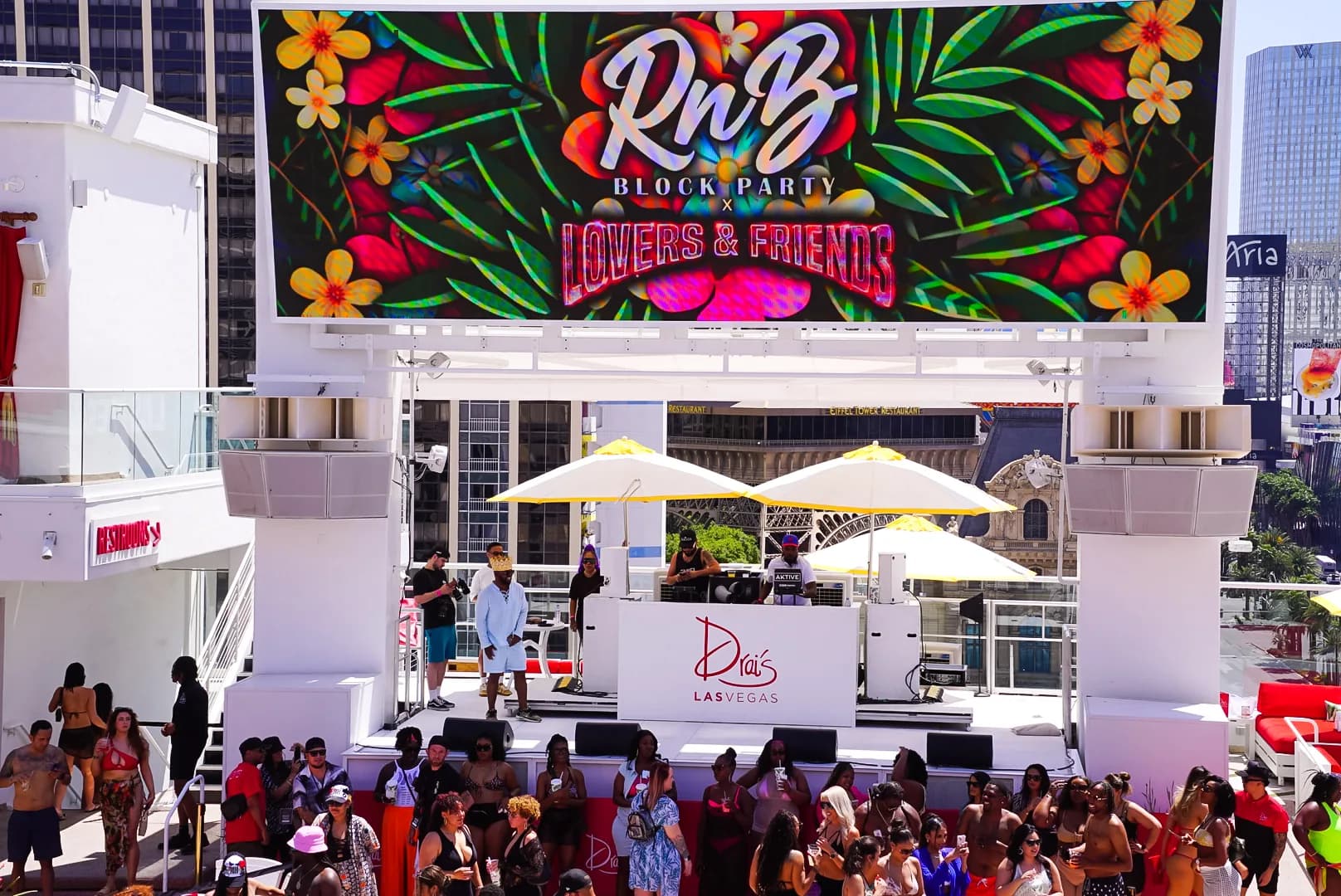 Crowd dancing under moody lights at RnB Block Party